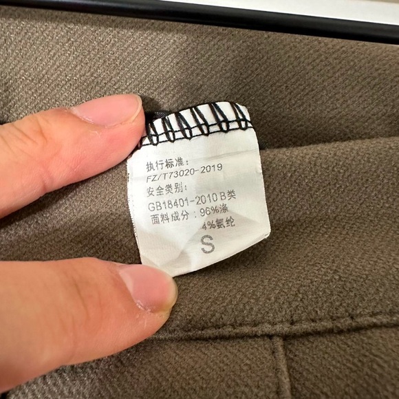 Brown pleated skirt side zipper with shorts underneath (skort) 

Length: 15 1/2" - Picture 3 of 3